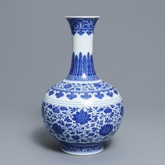 A Chinese blue and white Ming style bottle vase, Qianlong mark, 19/20th C.