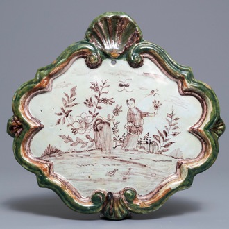 A polychrome Dutch Delft green and manganese plaque, 18th C.