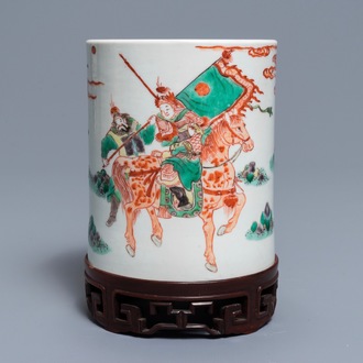 A Chinese famille verte brush pot on wooden stand, Kangxi