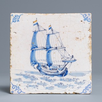 A Dutch Delft blue and white 'two-master with Dutch flag' tile, Harlingen, 17th C.