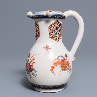 A polychrome petit feu and gilded Dutch Delft puzzle jug with insects and flowers, 1st half 18th C.