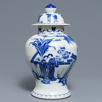 A Chinese blue and white vase and cover with ladies in a garden, 19th C.