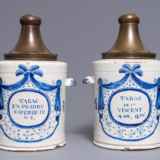 Two large blue and white Brussels faience tobacco jars with brass covers, 18th C.