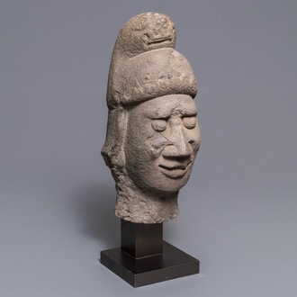 A Chinese carved stone head of a guardian, Ming