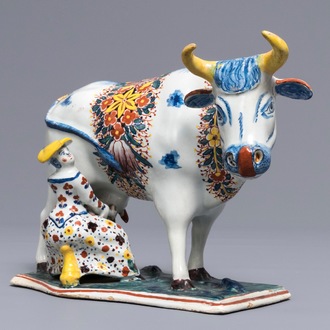A large Dutch Delft polychrome cow milking group, 18th C.
