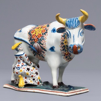 A large Dutch Delft polychrome cow milking group, 18th C.