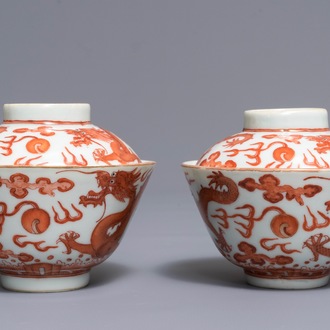 A pair of Chinese iron red and gilt dragon bowls and covers, Guangxu mark, 19/20th C.