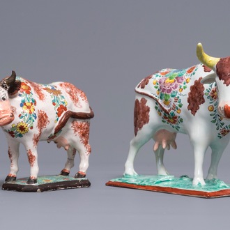 Two polychrome Dutch Delft petit feu cows on bases, 18th C.
