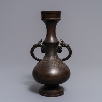 A Chinese bronze relief-decorated vase, Yuan/Ming