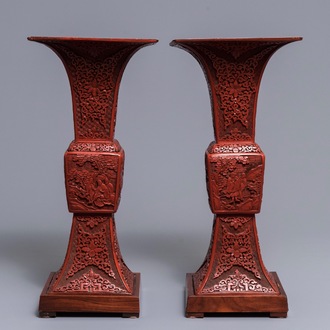 A pair of large Chinese carved cinnabar lacquer 'gu' vases, 18/19th C.