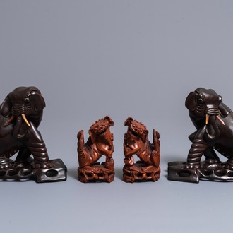 Two pairs of Chinese carved wood models of elephants and buddhist lions, Republic, 20th C.