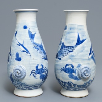 A pair of Chinese blue and white 'fish and crab' vases, Kangxi mark, 19th C.
