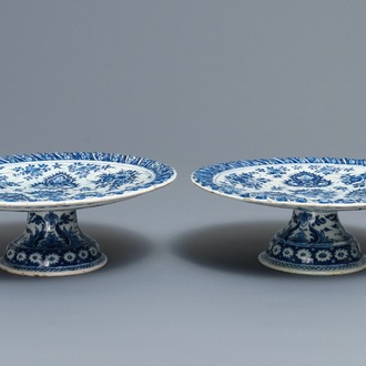 A pair of Dutch Delft blue and white tazza's with floral and ornamental design, 17/18th C.