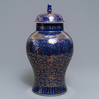 A Chinese powder blue-ground and gilt vase and cover, Kangxi mark, 19/20th C.