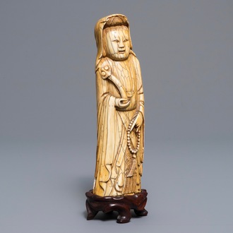 A Chinese carved ivory figure of a lady, Ming