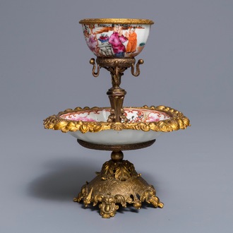 A Chinese famille rose 'mandarin' cup and saucer in gilt metal mount, Qianlong and 19th C.