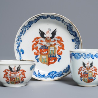 Two Chinese armorial cups and a saucer, Yongzheng