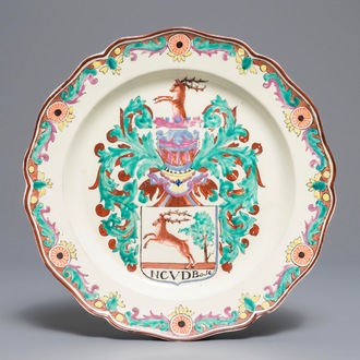 A Dutch-decorated English creamware armorial plate, 18th C.