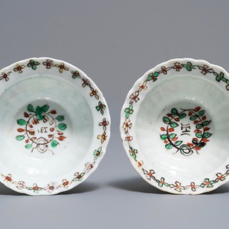 A pair of Chinese famille verte IHS-inscribed cups, Kangxi