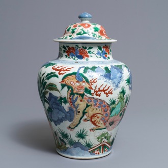 A Chinese wucai ‘mythical beasts’ vase and cover, Transitional period
