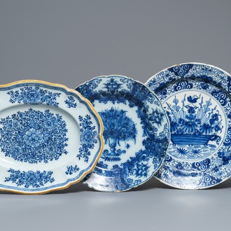 Two Dutch Delft blue and white chargers, an oval dish and a vase, 18th C.