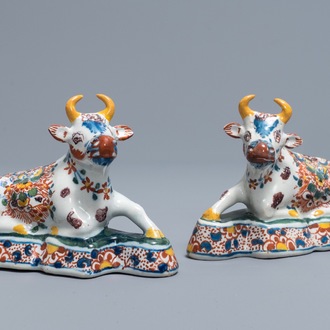 A pair of polychrome Dutch Delft models of recumbent cows, 18th C.