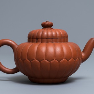 A Chinese Yixing stoneware 'chrysanthemum' teapot and cover, Kangxi