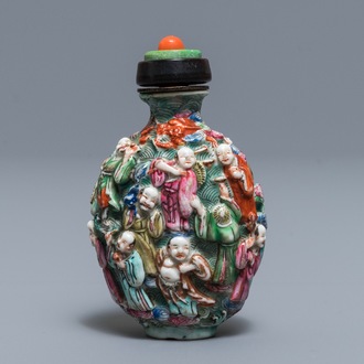 A Chinese famille rose relief-decorated snuff bottle, 19th C.