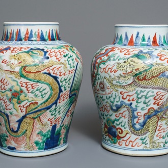 A pair of Chinese wucai ‘dragon and phoenix’ vases, Transitional period