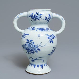 A Chinese blue and white elephant-handled vase with floral design, Transitional period