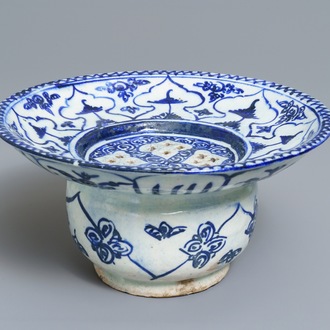 A large blue and white fritware spittoon or strainer, Qajar, Iran, 19th C.