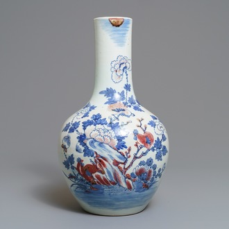 A Chinese blue, white and underglaze red 'rooster' vase, 19th C.