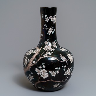 A Chinese famille noire tianqiu ping vase with birds among blossoms, 19th C.