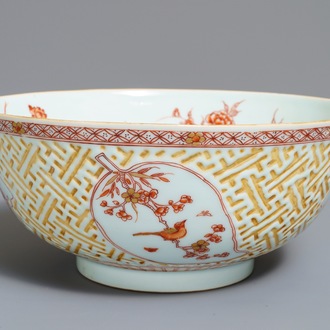A Chinese iron red and gilt relief-decorated bowl, Kangxi