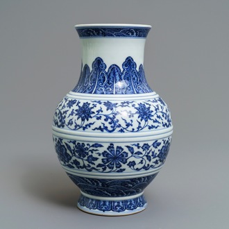 A Chinese blue and white 'flower scroll' vase, Qianlong mark, 19/20th C.