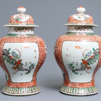 A pair of Chinese famille verte vases and covers, 19th C.