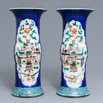 A pair of Chinese famille verte powder blue-ground gu vases, Kangxi mark, 19th C.