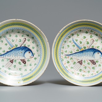 A pair of Brussels faience 'fish and cutlery' plates, 18th C.