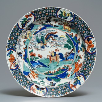 An exceptional polychrome Dutch Delft famille verte-style 'mythical beasts' dish, 18th C.