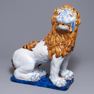 A massive French faience model of a lion, Rouen, 19th C