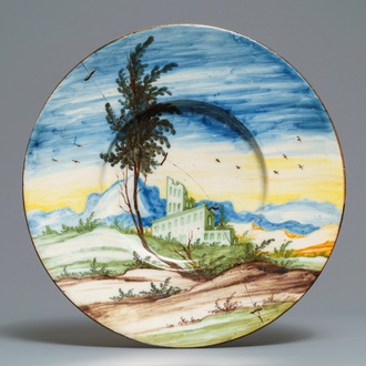 A large polychrome Italian maiolica landscape dish, Pavia, ca. 1700