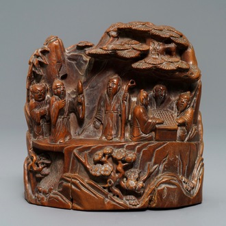 A Chinese carved hardwood group with sages in a garden, 18/19th C.