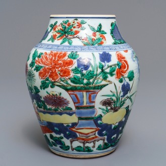 A Chinese wucai vase with vases in a garden, Transitional period