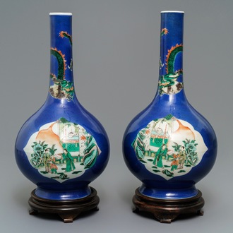 A pair of Chinese famille verte powder blue-ground bottle vases, 19th C.