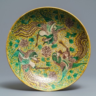 A Chinese green, yellow and aubergine-glazed biscuit 'phoenixes' dish, He He Jia Chan mark, Transitional period