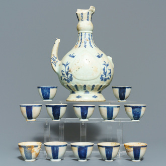 A Chinese shipwreck blue and white Islamic market 'aftaba' ewer and twelve cups, Transitional period