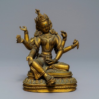 Une figure de Vasudhara en bronze doré incrusté, Tibet ou Népal, 18/19ème