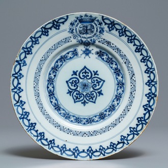 A Dutch Delft blue and white armorial plate, 2nd half 17th C.