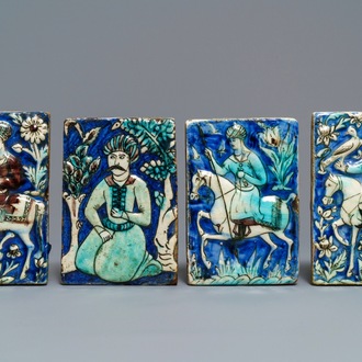 Four Qajar relief-moulded tiles with falconers, a soldier on horseback and a kneeling man, Iran, 19th C.