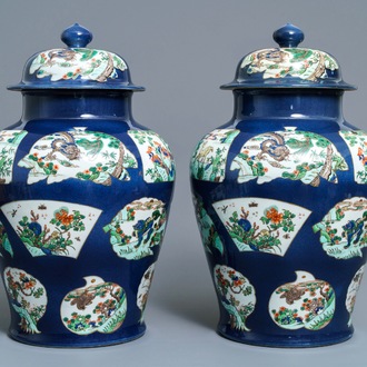 A pair of famille verte powder blue-ground vases and covers, Samson, Paris, 19th C.